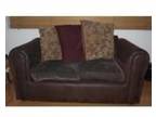 2 half leather sofas. 1 year old half leather sofas 1x 2....